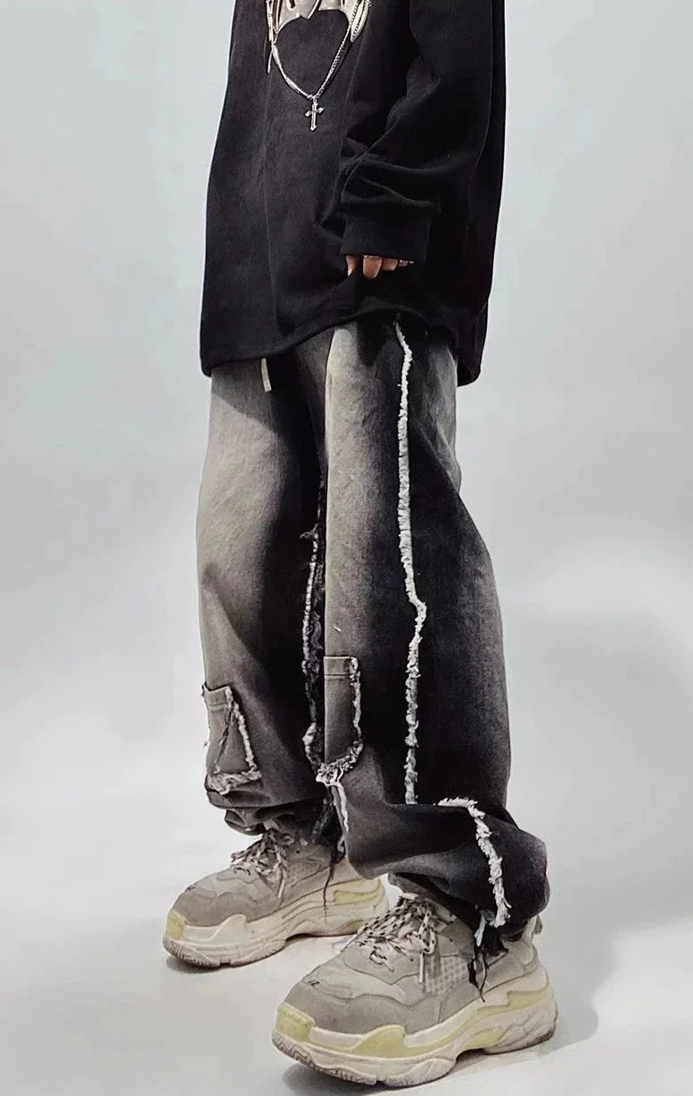 Czarne jeansy typu oversize z dziurami