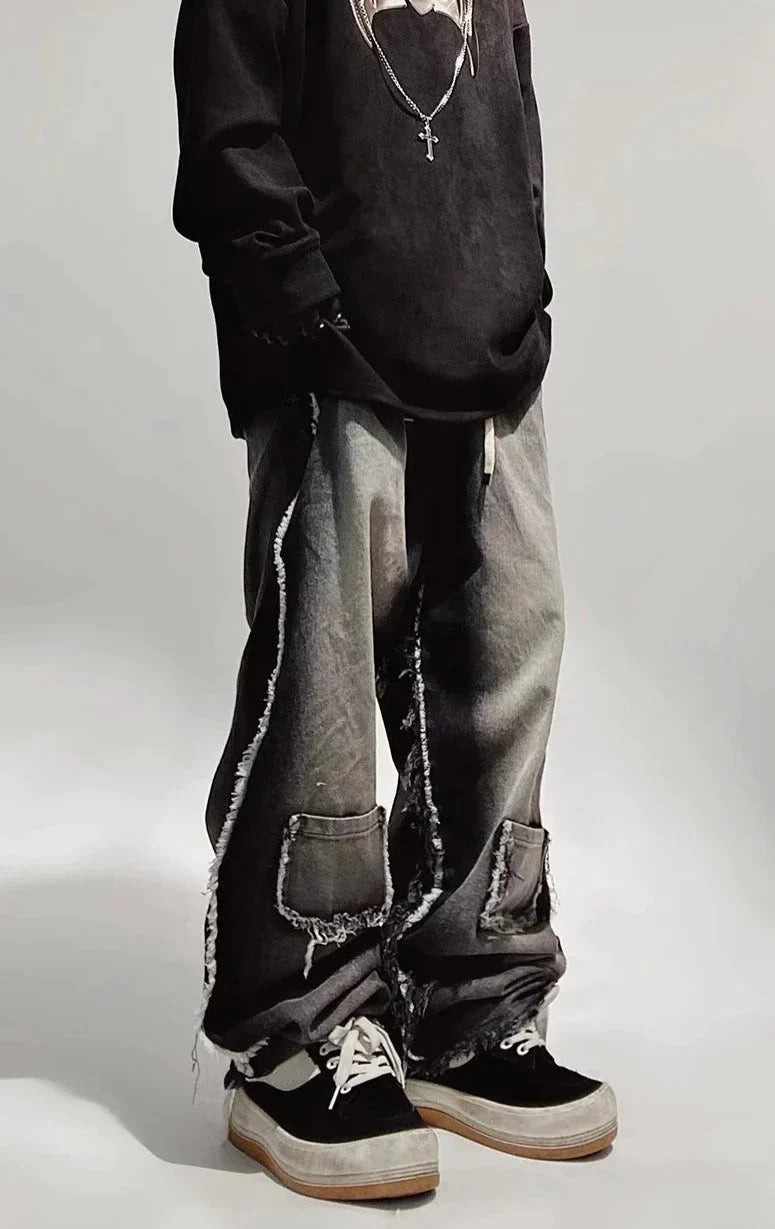 Czarne jeansy typu oversize z dziurami