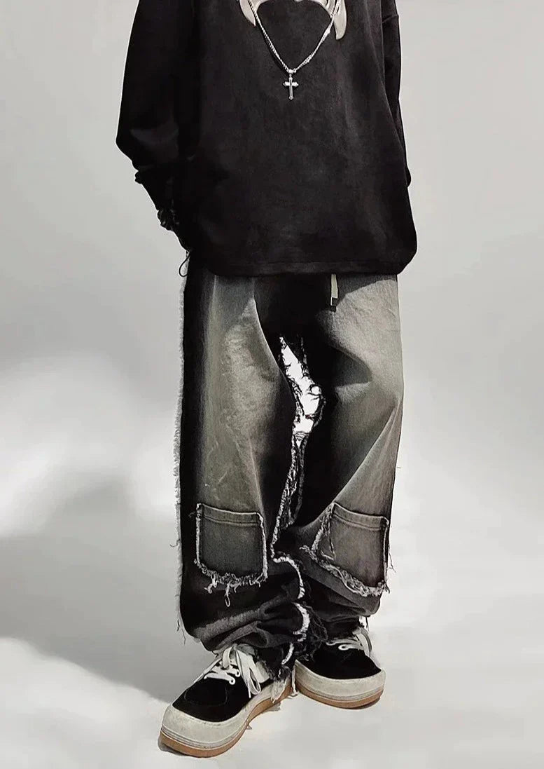 Czarne jeansy typu oversize z dziurami