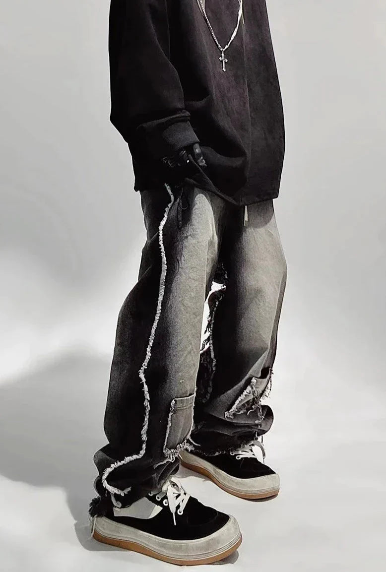 Czarne jeansy typu oversize z dziurami