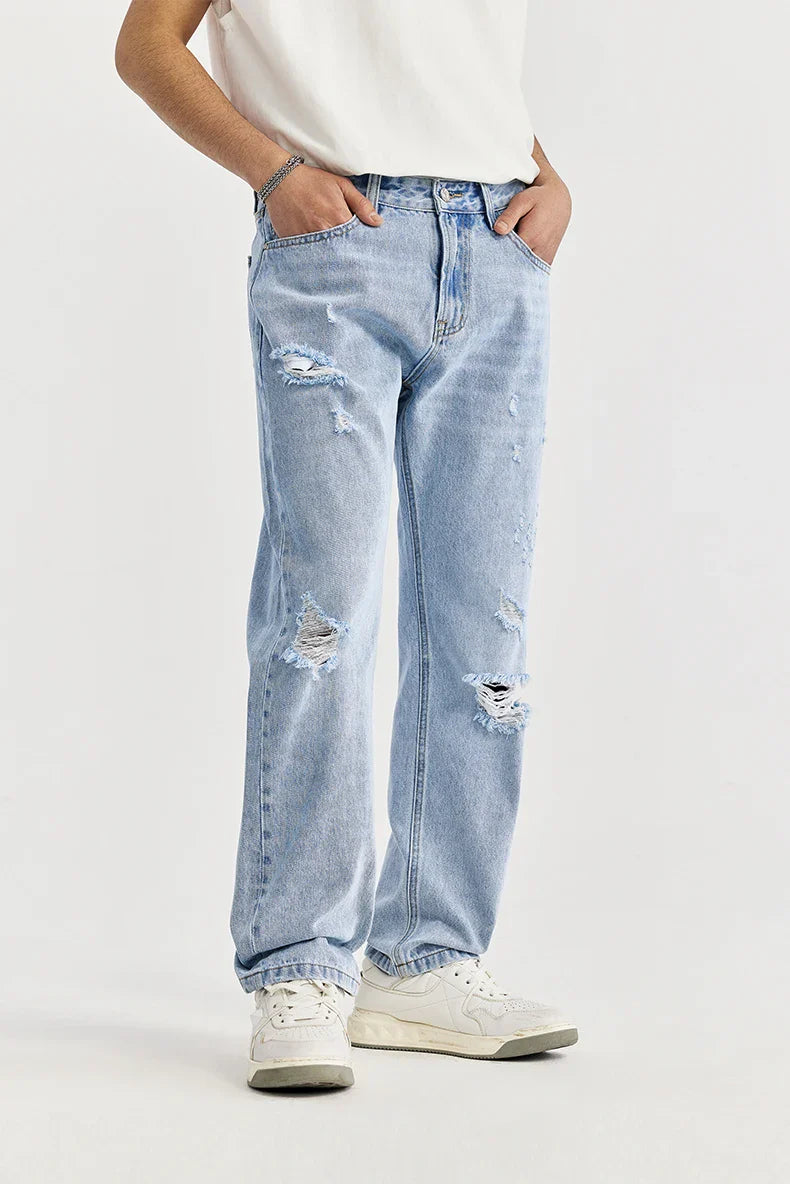 Przetarte jeansy slim fit