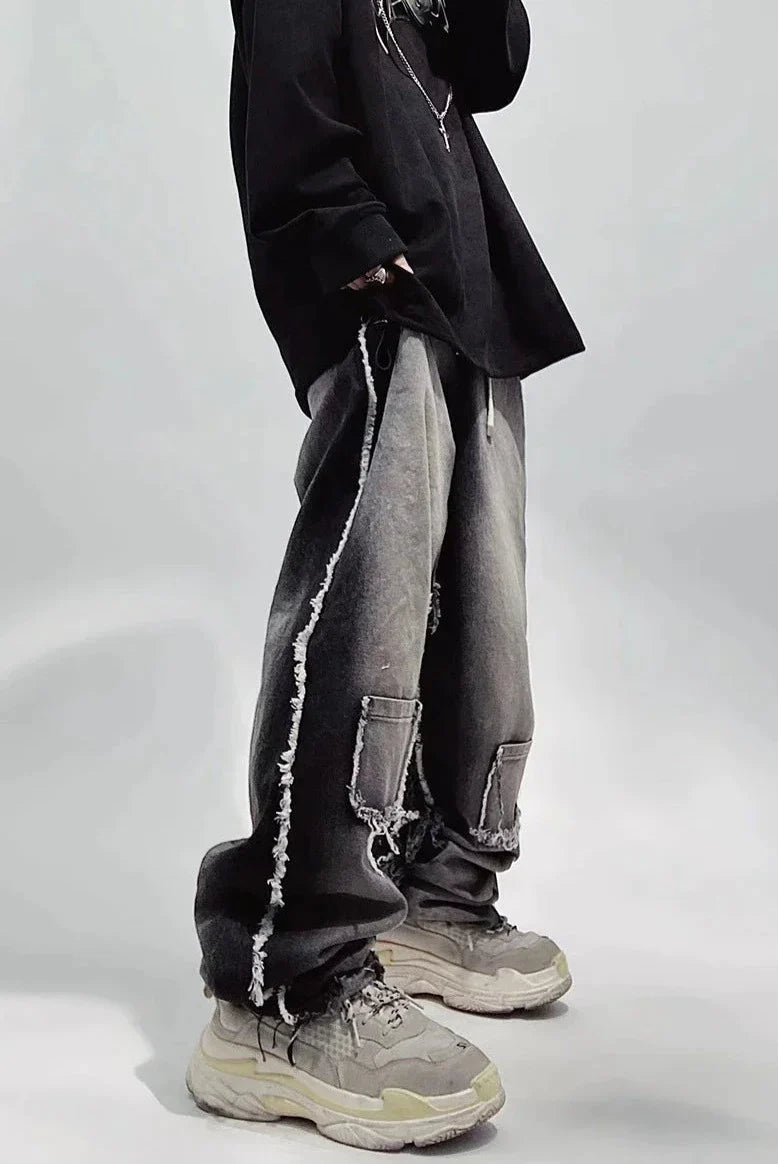 Czarne jeansy typu oversize z dziurami