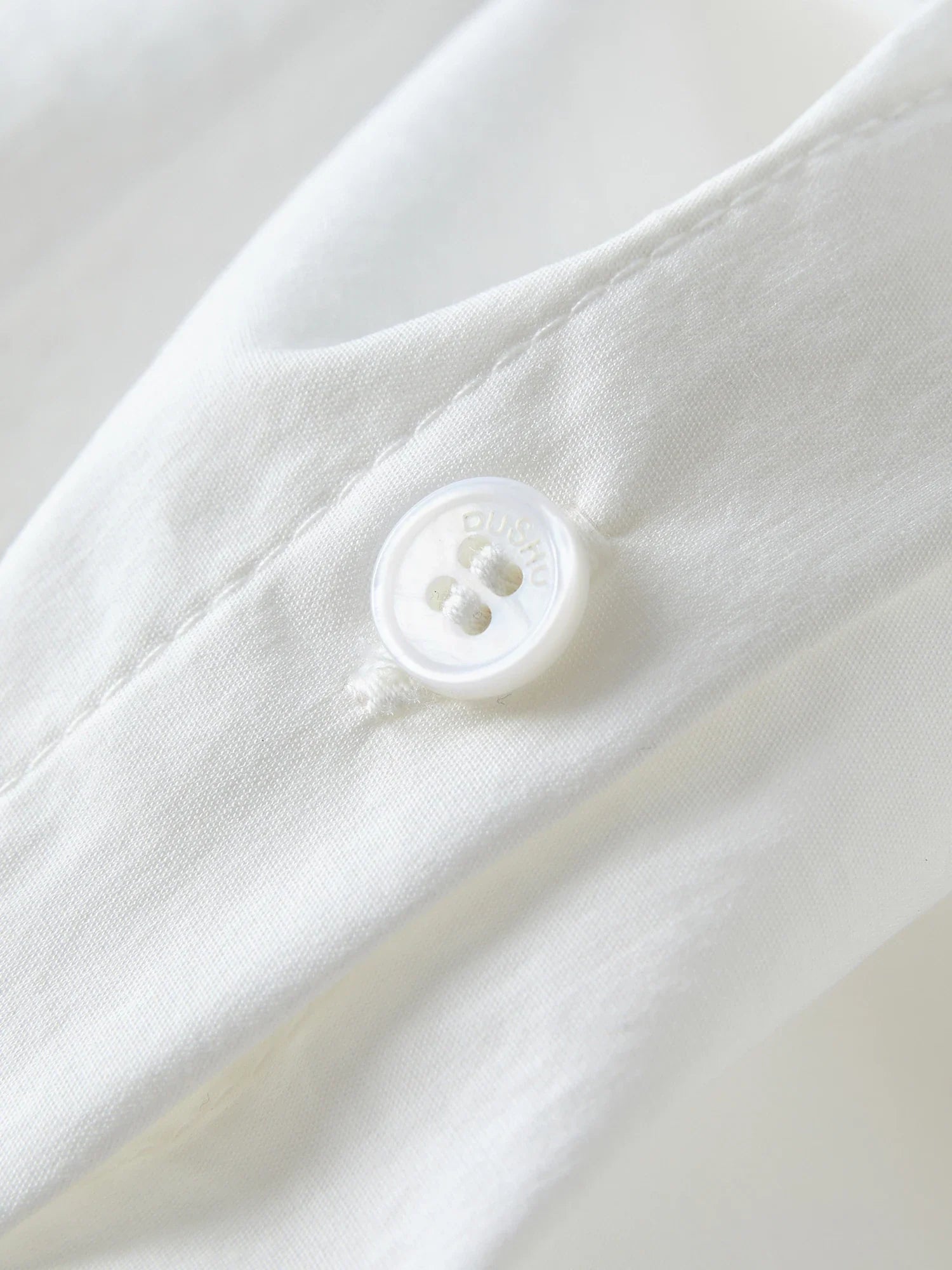 Elegancki biały komplet z falbaną, top i spódnica