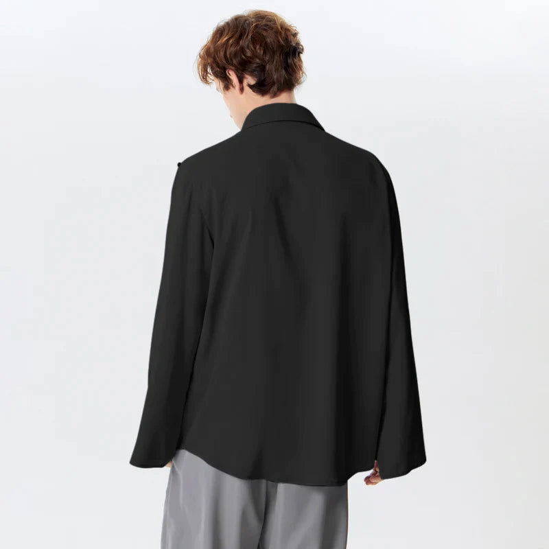 LuŸna koszula z rozciêciem na klapie, dęugim rêkawem i guzikami