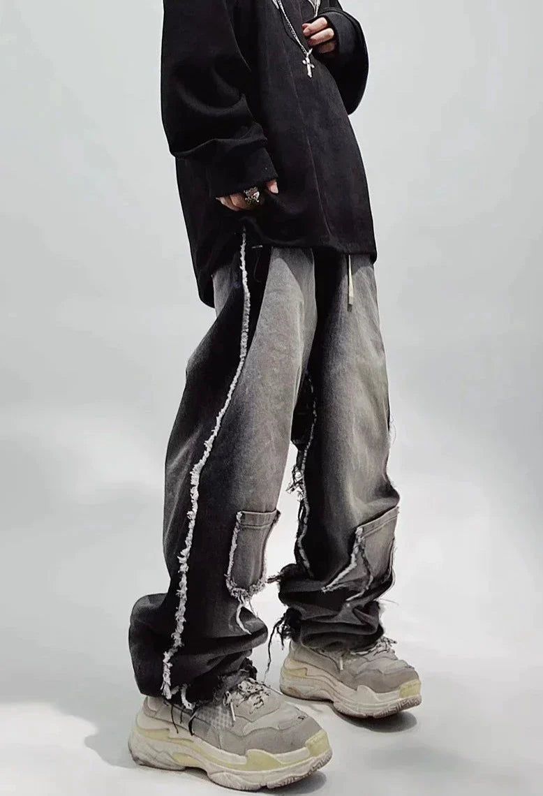 Czarne jeansy typu oversize z dziurami