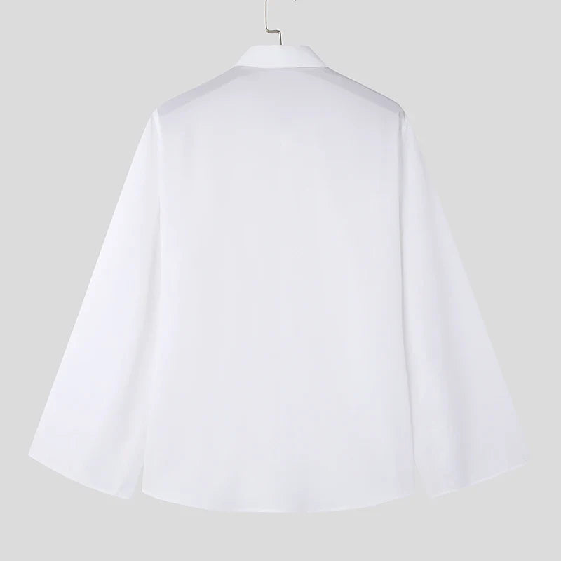 LuŸna koszula z rozciêciem na klapie, dęugim rêkawem i guzikami