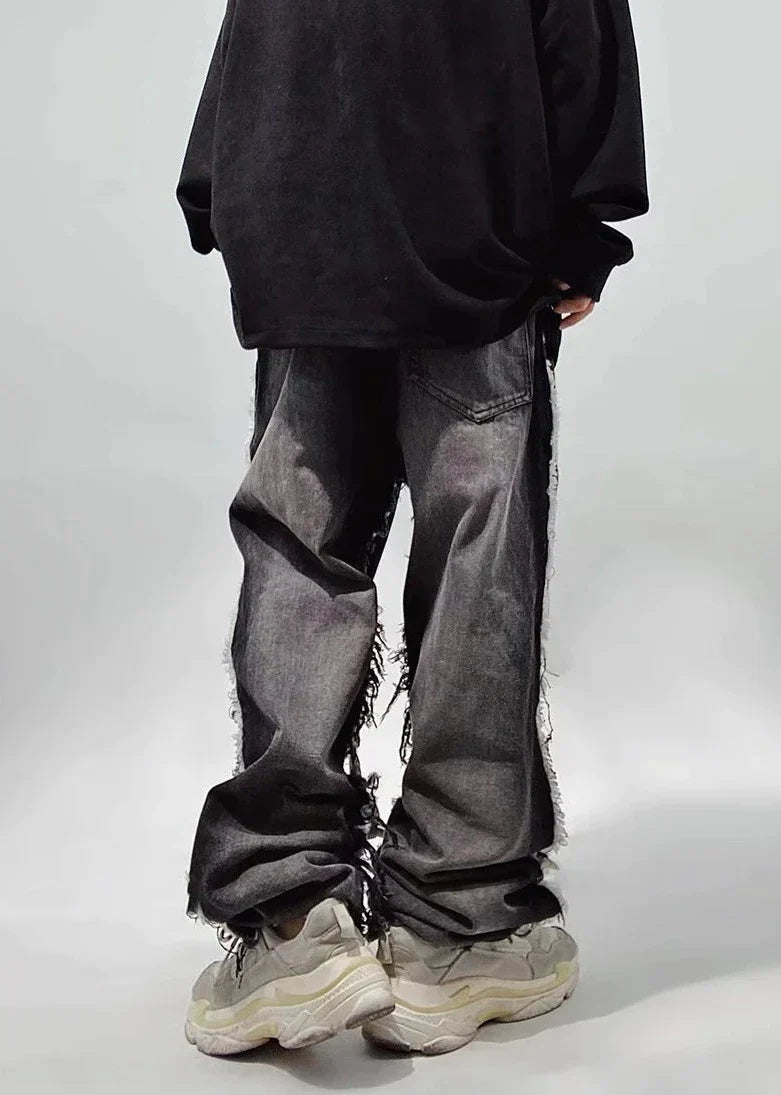 Czarne jeansy typu oversize z dziurami