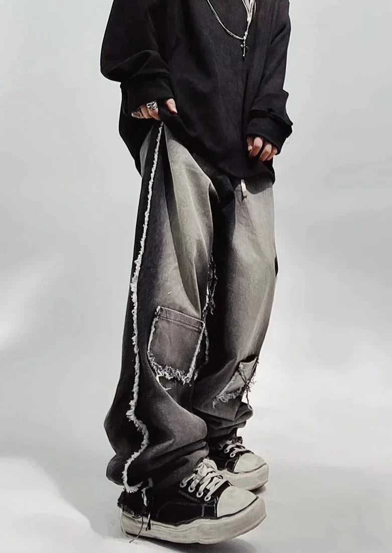 Czarne jeansy typu oversize z dziurami
