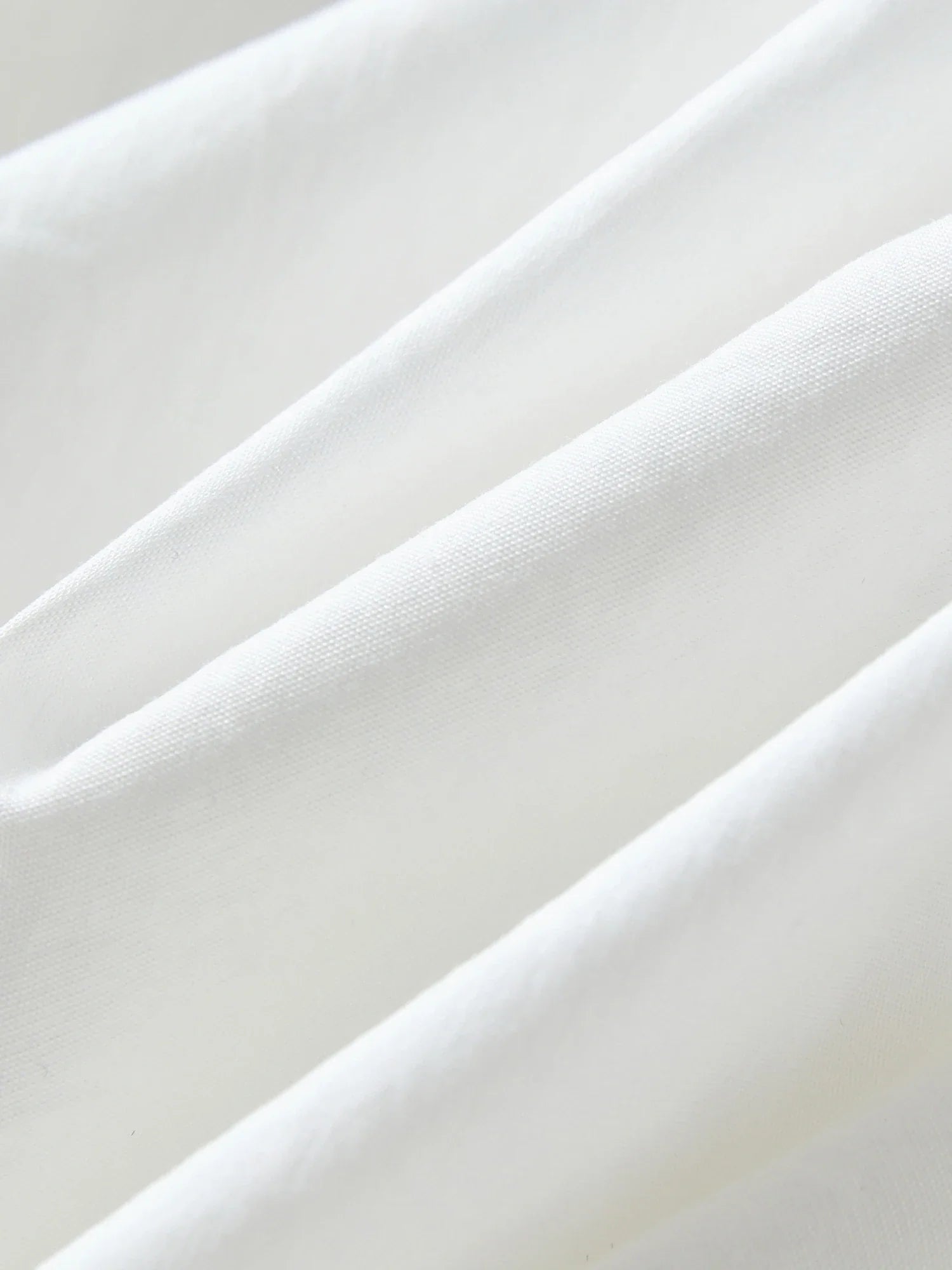 Elegancki biały komplet z falbaną, top i spódnica